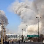 Irańczycy uciekają podczas ataku na Teheran. Fot. PAP/EPA/ABEDIN TAHERKENAREH