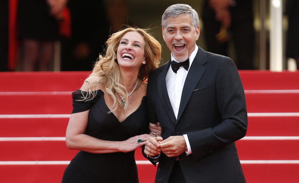 Fot. Julia Roberts i George Clooney przybywają na pokaz filmu „Money Monster” podczas 69. dorocznego Festiwalu Filmowego w Cannes. Fot. PAP/EPA/IAN LANGSDON