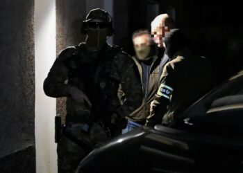 Patryk M. ps. Wielki Bu doprowadzany do Lubelskiego Wydziału Zamiejscowego Departamentu do Spraw Przestępczości Zorganizowanej i Korupcji Prokuratury Krajowej w Lublinie. Fot. PAP/Wojtek Jargiło